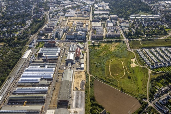 Aerial view, Areal Böhler commercial area and construction site at the VIERZIG549 residential complex in the Büderich district of Meerbusch, Rhineland, North Rhine-Westphalia, Germany, construction work, construction area, building site, building plots, construction project, construction site, DE, Düsseldorf, Europe, shapes and colours, commercial enterprises, commercial space, commercial area, commercial park, commercial location, commercial use, property tax, real estate, industrial area, industrial building, industrial location, aerial photograph, aerial photography, aerial photography, Meerbusch, new building, overview, bird's-eye view, residential area, residential area, residential buildings, residential quality, residential neighbourhood, residential estate, birds-eyes view, overview