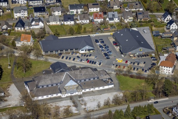 Aerial view, Schützenhalle, EDEKA Brilon, ALDI Brilon, local supply centre, Brilon, Sauerland, North Rhine-Westphalia, Germany, Aldi supermarket, DE, Edeka supermarket, shopping markets, shopping place, shopping centre, Europe, hall, aerial view, aerial photography, aerial photography, St. Hubertus-Schützenbruderschaft, overview, bird's-eye view, birds-eyes view, overview