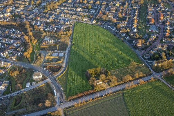 Aerial view, open space with meadow on the corner of Dorfheide and Rentforter Straße and construction site on Pater-Gahlen-Straße in the Kirchhellen district of Bottrop, Ruhr area, North Rhine-Westphalia, Germany, construction work, construction area, building site, building plots, construction project, construction site, Bottrop, DE, Europe, property tax, real estate, aerial view, aerial photography, aerial photography, new construction, overview, bird's-eye view, meadows and fields, housing estate, living and living, residential area, residential buildings, residential quality, residential neighbourhood, housing estate, birds-eyes view, overview