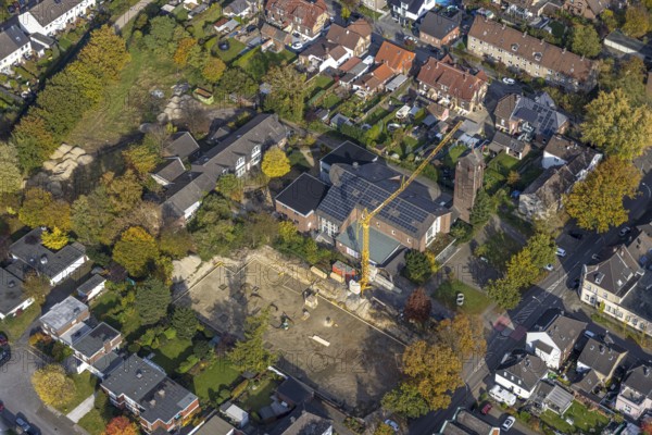 Aerial view, construction site at the former church St. Elisabeth with solar roof in the north-east district of Bottrop, Ruhr area, North Rhine-Westphalia, Germany, place of worship, construction work, construction area, building site, building plots, construction crane, construction project, construction site, Bottrop, DE, Europe, religious community, place of worship, holy place, church, parish, denomination, aerial view, aerial photography, aerial photography, religion, religious site, overview, bird's-eye view, overview