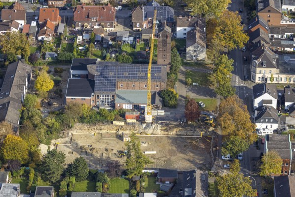 Aerial view, construction site at the former church St. Elisabeth with solar roof in the north-east district of Bottrop, Ruhr area, North Rhine-Westphalia, Germany, place of worship, construction work, construction area, building site, building plots, construction crane, construction project, construction site, Bottrop, DE, Europe, religious community, place of worship, holy place, church, parish, denomination, aerial view, aerial photography, aerial photography, religion, religious site, overview, bird's-eye view, overview