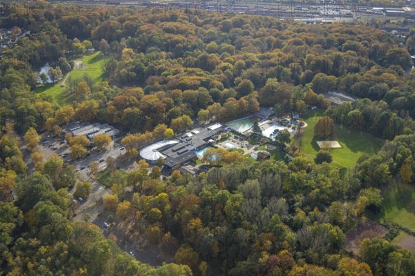 Aerial view, Solbad Vonderort with sauna, wellness and outdoor pool in the autumnal Revierpark Vonderort in the district Osterfeld in Oberhausen, Ruhr area, North Rhine-Westphalia, Germany, bathing establishment, bathing resort, DE, Europe, outdoor pool, leisure facility, leisure pool, leisure activities, leisure park, autumn forest, aerial view, aerial photography, aerial photography, Oberhausen, swimming pool, overview, bird's-eye view, overview