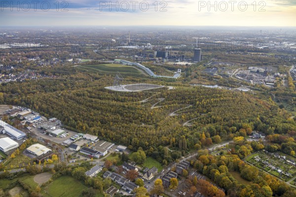 Aerial view, tetrahedron pyramid and serpentine path on the Beckstraße spoil tip as well as alpincenter Bottrop ski hall on the Prosperstraße spoil tip and former Prosper-Haniel mine in the Batenbrock-Nord district of Bottrop, Ruhr area, North Rhine-Westphalia, Germany, viewing terrace, Bottrop, DE, Europe, shapes and colours, Emscherblick slagheap event, autumn forest colours, aerial view, aerial photography, aerial photography, pyramid sculpture, sight, serpentine shape, tetrahedron, overview, bird's-eye view, forest area, birds-eyes view, overview