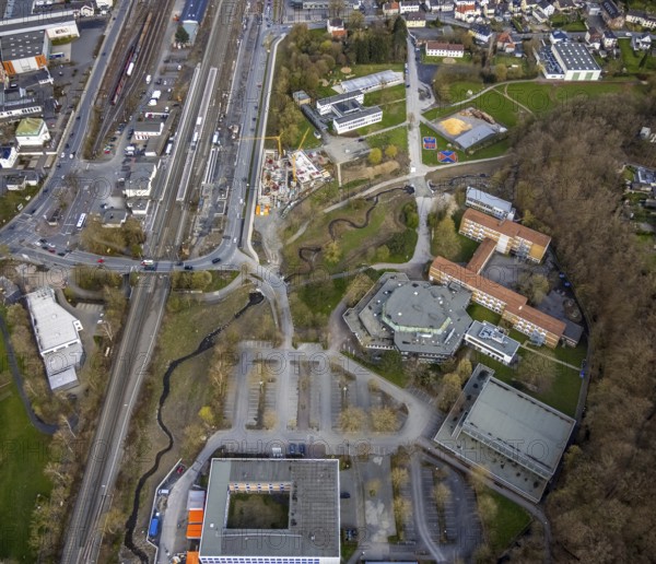 Aerial photo, construction site and new construction of vocational training centre on the educational campus on Kleinbahnstraße, Franz-Stock-Gymnasium, cultural centre, Sauerland-Kolleg, Hüsten, Arnsberg, Sauerland, North Rhine-Westphalia, Germany, construction work, construction area, building site, building plots, construction, construction project, construction site, education, educational institution, DE, Europe, grammar school, teaching institute, aerial view, aerial photography, aerial photography, new building, Sauerland-Kolleg Arnsberg, school, overview, bird's-eye view, overview, new course of stream, tree stream