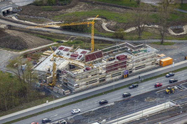 Aerial view, construction site and new construction of vocational training centre on the educational campus on Kleinbahnstraße, Hüsten, Arnsberg, Sauerland, North Rhine-Westphalia, Germany, construction work, construction area, building site, building plots, construction project, construction site, education, educational institution, DE, Europe, teaching institute, aerial view, aerial photography, aerial photography, new construction, school, overview, bird's-eye view, overview, new course of stream, tree stream