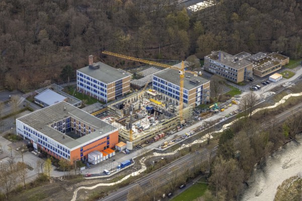 Aerial view, construction site and new building at Berufskolleg Berliner Platz, Hüsten, Arnsberg, Sauerland, North Rhine-Westphalia, Germany, construction work, construction area, construction site, building plots, construction crane, construction measure, construction project, construction site, education, educational institution, DE, Europe, college school, teaching institute, aerial view, aerial photography, aerial photography, new building, school, overview, bird's-eye view, overview