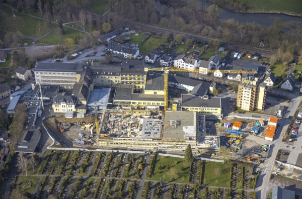 Aerial view, construction site and new building at Hochsauerland Clinic, Hüsten, Arnsberg, Sauerland, North Rhine-Westphalia, Germany, construction work, construction area, construction site, building plots, construction crane, construction measure, construction project, construction site, DE, Europe, healthcare, Hochsauerlandkreis, hospital, clinic, clinic centre, hospital, aerial view, aerial photography, aerial photography, medical facility, medical aid, emergency service, overview, bird's eye view, birds-eyes view, overview, medical care