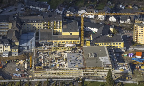 Aerial view, construction site and new building at Hochsauerland Clinic, Hüsten, Arnsberg, Sauerland, North Rhine-Westphalia, Germany, construction work, construction area, construction site, building plots, construction crane, construction measure, construction project, construction site, DE, Europe, healthcare, Hochsauerlandkreis, hospital, clinic, clinic centre, hospital, aerial view, aerial photography, aerial photography, medical facility, medical aid, emergency service, overview, bird's eye view, birds-eyes view, overview, medical care