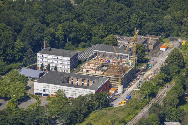 Aerial view, construction site and new building, Berufskolleg Berliner Platz, Hüsten, Arnsberg, Sauerland, North Rhine-Westphalia, Germany, construction work, construction area, construction site, building plots, construction crane, construction measure, construction project, construction site, education, educational institution, DE, Europe, Hochsauerlandkreis, college school, teaching institute, aerial view, aerial photography, aerial photography, new building, school, overview, bird's-eye view, overview