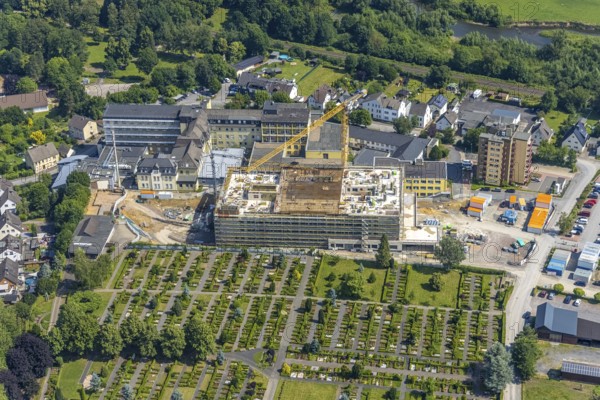 Aerial view, construction site and extension of Hochsauerland Karolinen-Hospital Hüsten, Hüsten, Arnsberg, Sauerland, North Rhine-Westphalia, Germany, construction work, construction area, building site, building plots, construction project, construction site, DE, Europe, health care, Hochsauerlandkreis, hospital, clinic, clinic centre, hospital, aerial photograph, aerial photography, aerial photography, medical facility, medical aid, new building, overview, bird's eye view, birds-eyes view, overview, medical care