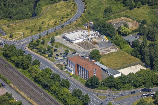 Aerial view, construction site and new construction of the Hagelstein rescue station next to the Arnsberg police station - Police Station West, Hüsten, Arnsberg, Sauerland, North Rhine-Westphalia, Germany, eye of the law, construction work, construction area, construction site, building plots, construction project, construction project, construction site, DE, Europe, Hochsauerlandkreis, aerial view, aerial photography, aerial photography, new building, law enforcement officer, police, police station, police station, rescue station, state authority, state power, overview, bird's-eye view, overview