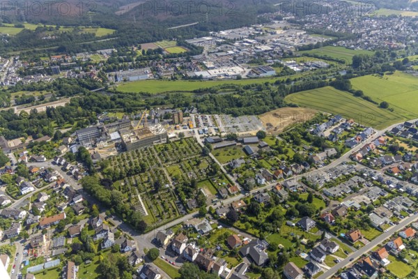 Aerial view, construction site and extension of Hochsauerland Karolinen-Hospital Hüsten, Hüsten, Arnsberg, Sauerland, North Rhine-Westphalia, Germany, construction work, construction area, building site, building plots, construction project, construction site, burial site, DE, Europe, cemetery, memorial, health care, Gottesacker, graves, burial ground, Hochsauerlandkreis, hospital, Kath. St. Petri cemetery, clinic, hospital, hospital centre, hospital, aerial view, aerial photography, aerial photography, medical facility, medical aid, new building, resting place, overview, bird's-eye view, bird's-eye view, overview, medical care