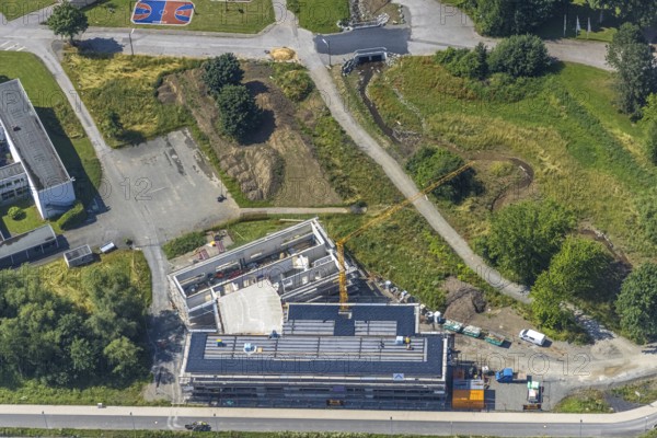 Aerial photo, construction site, new building, extension of Hochsauerlandkreis vocational college, Hüsten, Arnsberg, Sauerland, North Rhine-Westphalia, Germany, construction work, construction site, building plots, construction project, building site, education, educational institution, DE, Europe, Hochsauerlandkreis, college, educational institute, aerial photograph, aerial photography, aerial photography, new building, school, overview, bird's-eye view, overview