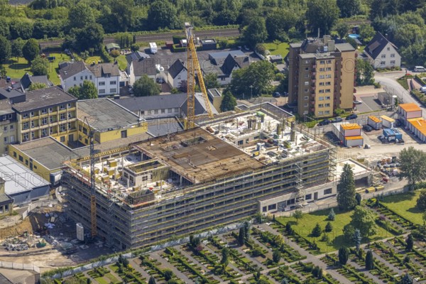 Aerial view, construction site and extension of Hochsauerland Karolinen-Hospital Hüsten, Hüsten, Arnsberg, Sauerland, North Rhine-Westphalia, Germany, construction work, construction area, building site, building plots, construction project, construction site, DE, Europe, health care, Hochsauerlandkreis, hospital, clinic, clinic centre, hospital, aerial photograph, aerial photography, aerial photography, medical facility, medical aid, new building, overview, bird's eye view, birds-eyes view, overview, medical care
