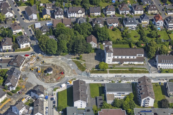 Aerial view, construction site and redesign of roundabout Pfarrer-Leo-Reiners-Platz, formerly Ehmsenplatz, Alter Holzweg, catholic church St. Michael, Neheim, Arnsberg, Sauerland, North Rhine-Westphalia, Germany, place of worship, construction work, construction area, building site, building plots, construction project, construction site, DE, Europe, religious community, place of worship, sacred site, Hochsauerlandkreis, church, parish, denomination, roundabout, roundabout, aerial view, aerial photography, aerial photography, religion, religious site, overview, bird's eye view, birds-eyes view, overview