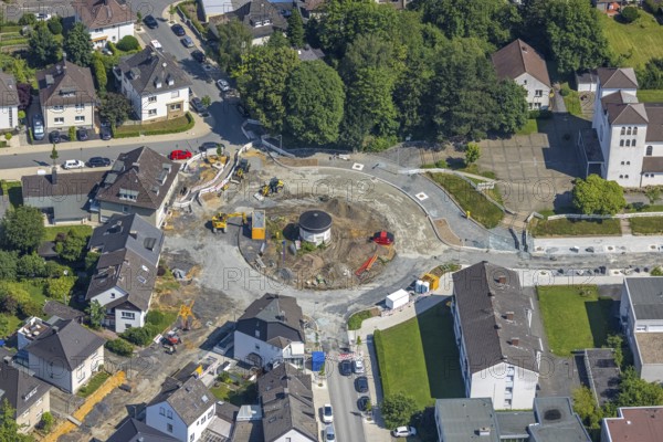 Aerial view, construction site and redesign of roundabout Pfarrer-Leo-Reiners-Platz, formerly Ehmsenplatz, Alter Holzweg, catholic St. Michael Church, Neheim, Arnsberg, Sauerland, North Rhine-Westphalia, Germany, place of worship, construction work, construction area, construction site, building plots, construction project, construction site, DE, Europe, religious community, place of worship, sacred site, Hochsauerlandkreis, church, church community, denomination, roundabout, roundabout, aerial view, aerial photography, aerial photography, religion, religious site, overview, bird's-eye view, birds-eyes view, overview