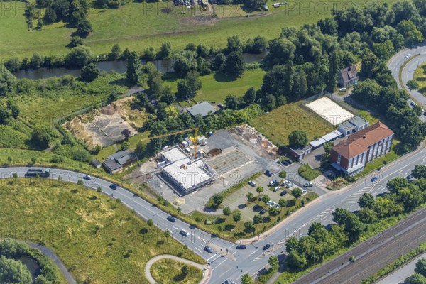 Aerial view, construction site and new construction of the Hagelstein rescue station next to the Arnsberg police station - Police Station West, Hüsten, Arnsberg, Sauerland, North Rhine-Westphalia, Germany, eye of the law, construction work, construction area, construction site, building plots, construction project, construction project, construction site, DE, Europe, Hochsauerlandkreis, aerial view, aerial photography, aerial photography, new building, law enforcement officer, police, police station, police station, rescue station, state authority, state power, overview, bird's-eye view, overview