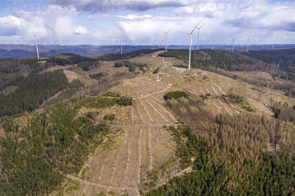 Aerial photo, wind turbines and forest damage in the Banfe forest area, Bad Laasphe, Siegerland, North Rhine-Westphalia, Germany, tree dieback, DE, Europe, aerial photo, aerial photography, aerial photography, overview, bird's-eye view, wind turbines, forest, forest area, forest damage, forest dieback, wind energy, wind turbine, wind power, wind turbine, wind turbines, bird's-eye view, overview, bark beetle plague, spruce dieback, clearing, tree clearing, deforestation, wood pile