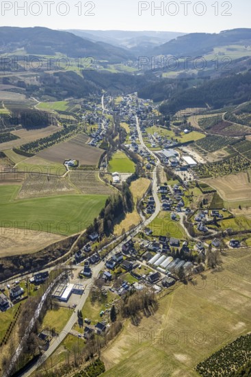 Aerial view, forest area and village view Heringhausen, Bestwig, Sauerland, North Rhine-Westphalia, Germany, DE, Europe, distant view, hilly landscape, aerial view, aerial photography, aerial photography, overview, bird's eye view, forest area, meadows and fields, birds-eyes view, overview