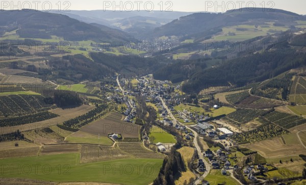 Aerial view, forest area and village view Heringhausen, Bestwig, Sauerland, North Rhine-Westphalia, Germany, DE, Europe, distant view, hilly landscape, aerial view, aerial photography, aerial photography, overview, bird's eye view, forest area, meadows and fields, birds-eyes view, overview