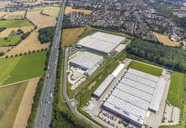 Aerial view, commercial area Lünener Straße at the motorway A2, Heldt Gebäudetechnik and DHL Ernst-von-Bodelschwingh-Street in Weddinghofen, Bergkamen, Ruhr area, North Rhine-Westphalia, Germany, DE, DHL Logistik, Europe, commercial enterprises, commercial area, commercial park, commercial location, commercial use, industrial area, industrial building, industrial location, aerial photograph, aerial photography, aerial photography, overview, bird's-eye view, birds-eyes view, overview