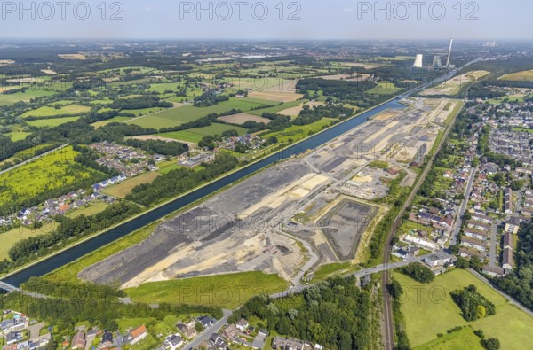 Aerial view, construction site for planned urban quarter Wasserstadt Aden on the site of the former Haus Aden colliery on the Datteln-Hamm Canal in Oberaden, Bergkamen, Ruhr area, North Rhine-Westphalia, Germany, construction work, construction area, building site, building plots, construction project, construction site, DE, Europe, canal, aerial view, aerial photography, aerial photography, new building, overview, bird's eye view, living and living, residential neighbourhood, birds-eyes view, overview