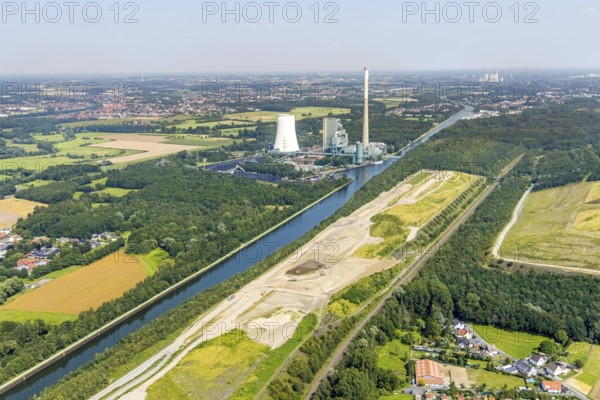 Aerial view, construction site for planned urban quarter Wasserstadt Aden on the site of the former Haus Aden colliery on the Datteln-Hamm Canal with Bergkamen power station in Oberaden, Bergkamen, Ruhr area, North Rhine-Westphalia, Germany, construction work, construction area, building site, building plots, construction measure, construction project, construction site, DE, Europe, canal, aerial view, aerial photography, aerial photography, new building, overview, bird's eye view, living and living, residential quarter, birds-eyes view, overview