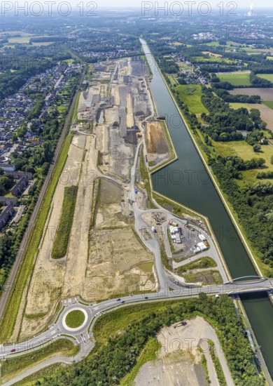 Aerial view, construction site for planned urban quarter Wasserstadt Aden with new roundabout on the site of the former Haus Aden colliery on the Datteln-Hamm canal in Oberaden, Bergkamen, Ruhr area, North Rhine-Westphalia, Germany, construction work, construction area, building site, building plots, construction measure, construction project, construction site, DE, Europe, canal, roundabout, roundabout, aerial view, aerial photography, aerial photography, new building, overview, bird's eye view, living and life, residential quarter, birds-eyes view, overview