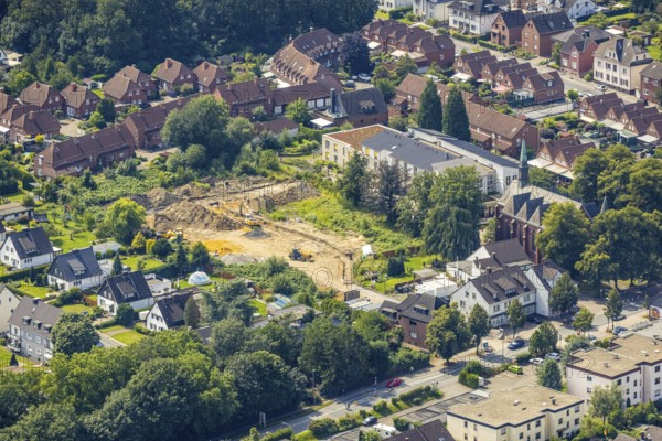 Aerial view, Herz Jesu Kirche and Seniorenzentrum Beckinghausen as well as construction site for residential development on the former company site of the building materials trade Brandt on Kamener Straße in the district of Beckinghausen, Bergkamen, Ruhr area, North Rhine-Westphalia, Germany, place of worship, construction work, construction area, building site, building plots, building project, construction project, construction site, DE, Europe, religious community, place of worship, holy place, church, church community, denomination, aerial view, aerial photography, aerial photography, religion, religious site, overview, bird's-eye view, overview