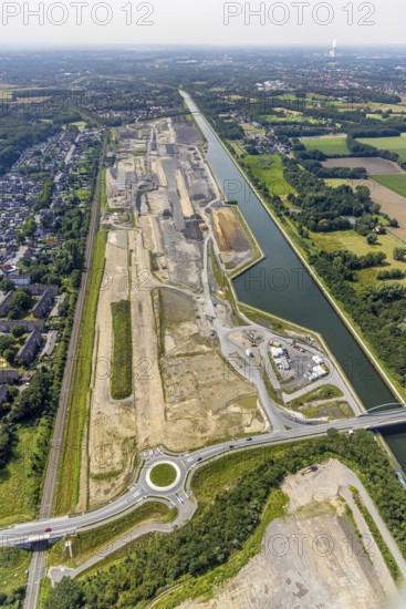 Aerial view, construction site for planned urban quarter Wasserstadt Aden with new roundabout on the site of the former Haus Aden colliery on the Datteln-Hamm canal in Oberaden, Bergkamen, Ruhr area, North Rhine-Westphalia, Germany, construction work, construction area, building site, building plots, construction measure, construction project, construction site, DE, Europe, canal, roundabout, roundabout, aerial view, aerial photography, aerial photography, new building, overview, bird's eye view, living and life, residential quarter, birds-eyes view, overview