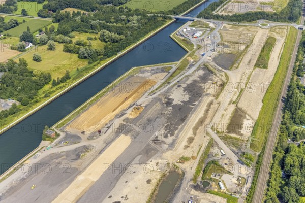 Aerial view, construction site for planned urban quarter Wasserstadt Aden on the site of the former Haus Aden colliery on the Datteln-Hamm Canal in Oberaden, Bergkamen, Ruhr area, North Rhine-Westphalia, Germany, construction work, construction area, building site, building plots, construction project, construction site, DE, Europe, canal, aerial view, aerial photography, aerial photography, new building, overview, bird's eye view, living and living, residential neighbourhood, birds-eyes view, overview