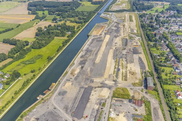 Aerial view, construction site for planned urban quarter Wasserstadt Aden on the site of the former Haus Aden colliery on the Datteln-Hamm Canal in Oberaden, Bergkamen, Ruhr area, North Rhine-Westphalia, Germany, construction work, construction area, building site, building plots, construction project, construction site, DE, Europe, canal, aerial view, aerial photography, aerial photography, new building, overview, bird's eye view, living and living, residential neighbourhood, birds-eyes view, overview