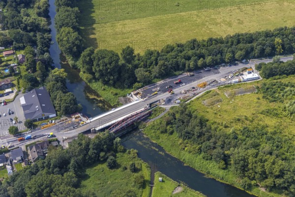 Aerial view, construction site and new construction of a bridge on Werner Straße over the river Lippe in Rünthe, Bergkamen, Ruhr area, North Rhine-Westphalia, Germany, construction work, construction area, building site, building plots, construction measure, construction project, construction site, bridge, bridge construction, bridge crossing, federal road B233, DE, Europe, property tax, aerial view, aerial photography, aerial photography, new construction, overview, bird's eye view, overview