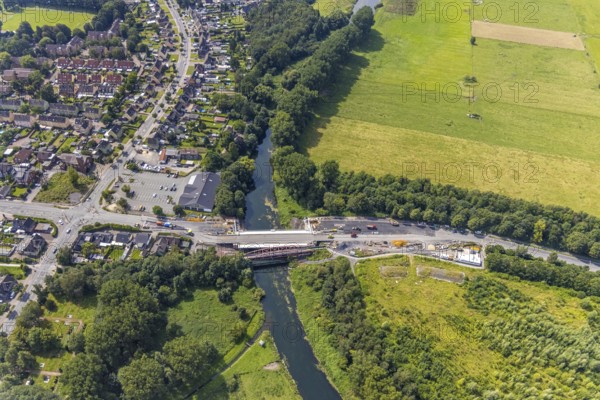 Aerial view, construction site and new construction of a bridge on Werner Straße over the river Lippe in Rünthe, Bergkamen, Ruhr area, North Rhine-Westphalia, Germany, construction work, construction area, building site, building plots, construction measure, construction project, construction site, bridge, bridge construction, bridge crossing, federal road B233, DE, Europe, property tax, aerial view, aerial photography, aerial photography, new construction, overview, bird's eye view, overview