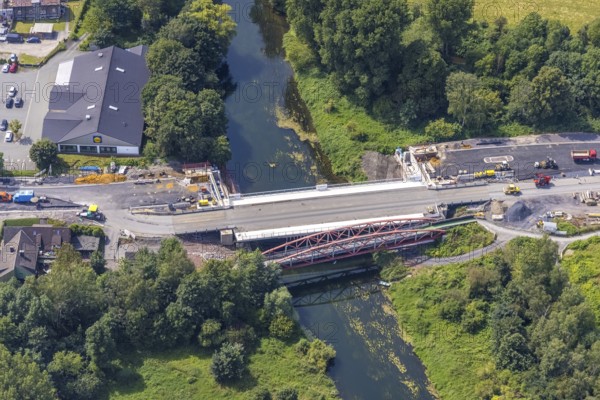 Aerial view, construction site and new construction of a bridge on Werner Straße over the river Lippe in Rünthe, Bergkamen, Ruhr area, North Rhine-Westphalia, Germany, construction work, construction area, building site, building plots, construction measure, construction project, construction site, bridge, bridge construction, bridge crossing, federal road B233, DE, Europe, property tax, aerial view, aerial photography, aerial photography, new construction, overview, bird's eye view, overview