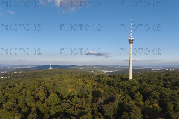 Sublime television tower above a green forest landscape with blue sky and clouds, Stuttgart-Degerloch, Baden-Württemberg, Germany