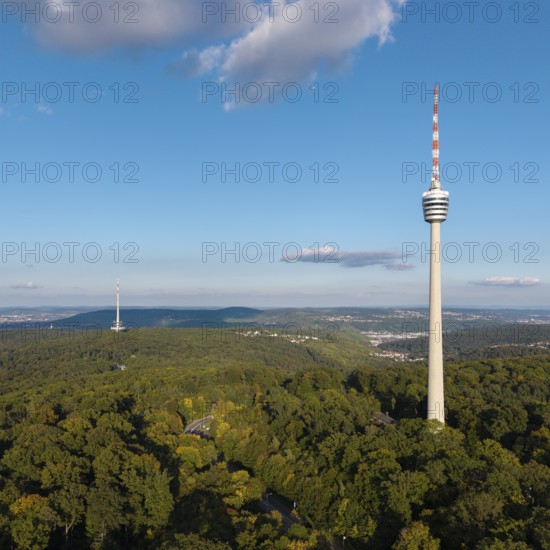 High television tower above lush greenery, soft clouds in the clear sky, Stuttgart-Degerloch, Baden-Württemberg, Germany