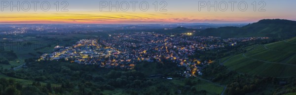 Panoramic view of a town at dusk, illuminated streets and surrounding hills, Korb im Remstal, Baden-Württemberg, Germany