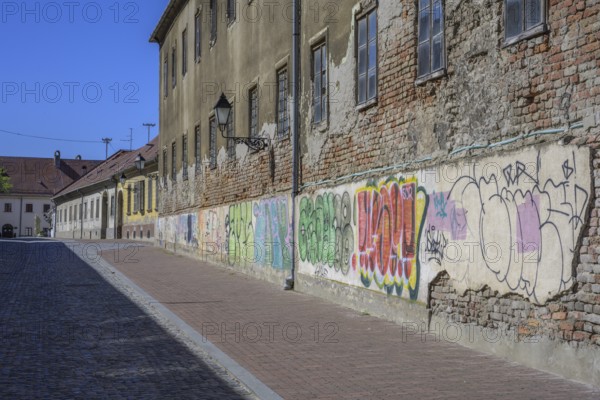 Dilapidated house with graffiti in the old town centre of Tvrda, Osijek, Osijek-Baranja County, Croatia