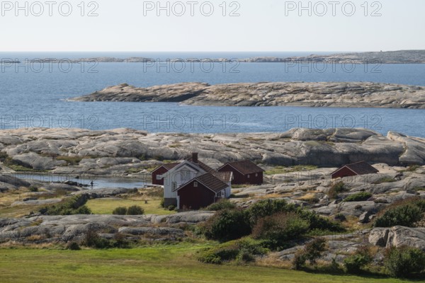 Houses by the sea, Bohus Granit, Ramsvik, Ramsviklandet nature reserve, archipelago, Bohuslän, Skagerrak, Sotenäs, Västra Götalands län, Sweden