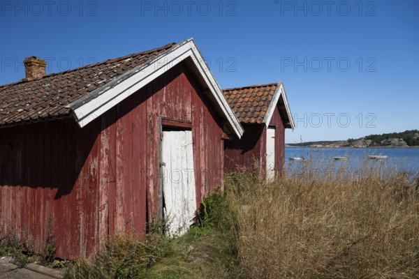 Falun red or Swedish red boathouses, Resö Island, Bohuslän, Skagerrak, Sotenäs, Västra Götalands län, Sweden