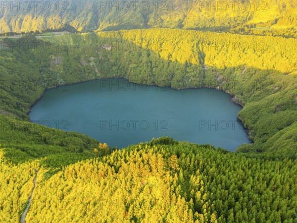 Lake Santiago. Sete Cidades Caldera at Sunset. Lush Green Hills with Forest. Azores, Sao Miguel Island. Portugal. Aerial View