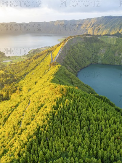 Lake Santiago and Blue Lake. Sete Cidades Caldera at Sunset. Lush Green Hills with Forest. Azores, Sao Miguel Island. Portugal. Aerial View