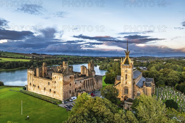 Sunset over Linlithgow Palace from a drone, Linlithgow Loch, West Lothian, Scotland, United Kingdom
