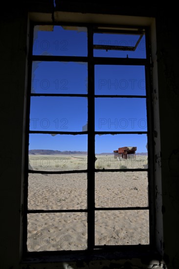 View from the window of the old German railway station of Garub into the Namib Desert, near Aus, Karas Region, Namibia
