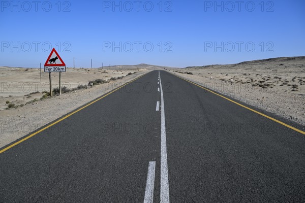 Sign warning of brown hyenas or beach wolves (Parahyaena brunnea), near Lüderitz, Karas Region, Namibia