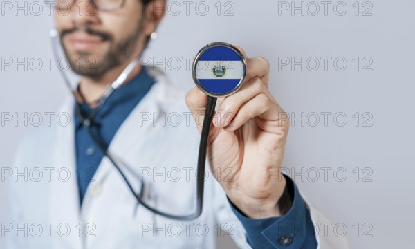 Doctor holding stethoscope with El Salvador flag. El Salvador health and care concept. El Salvador flag on stethoscope