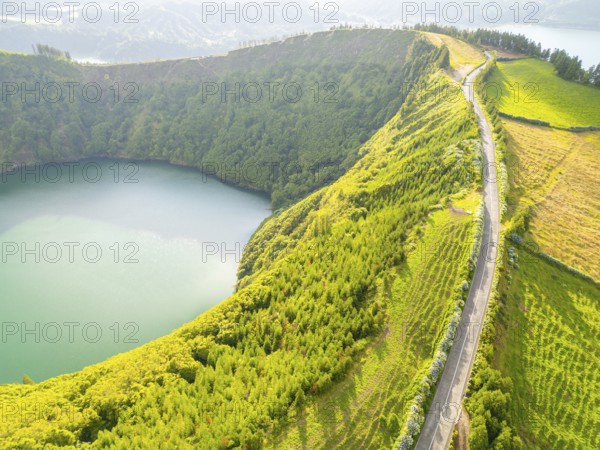 Road with Hydrangeas. Green Fields, Forest, Hills and Lake. Azores, Sao Miguel Island. Portugal. Aerial View