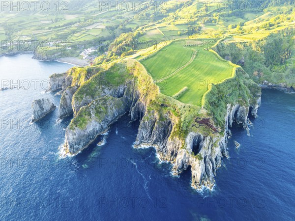 Cape Furado, Cliffs, Green Lush Fields, Pasturelands and Atlantic Ocean on Sunny Morning. Azores, Sao Miguel Island. Portugal. Aerial View