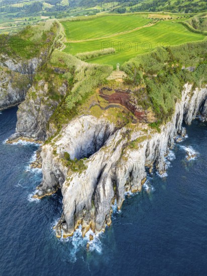 Cape Furado, Rocky Cliffs, Green Lush Fields, Pasturelands and Atlantic Ocean. Azores, Sao Miguel Island. Portugal. Aerial View